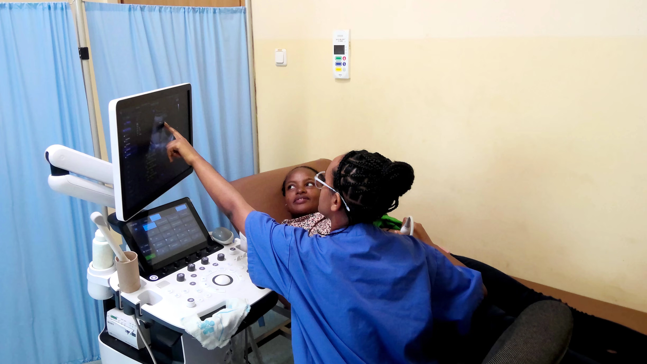 Midwife assisting a pregnant mother during check-up